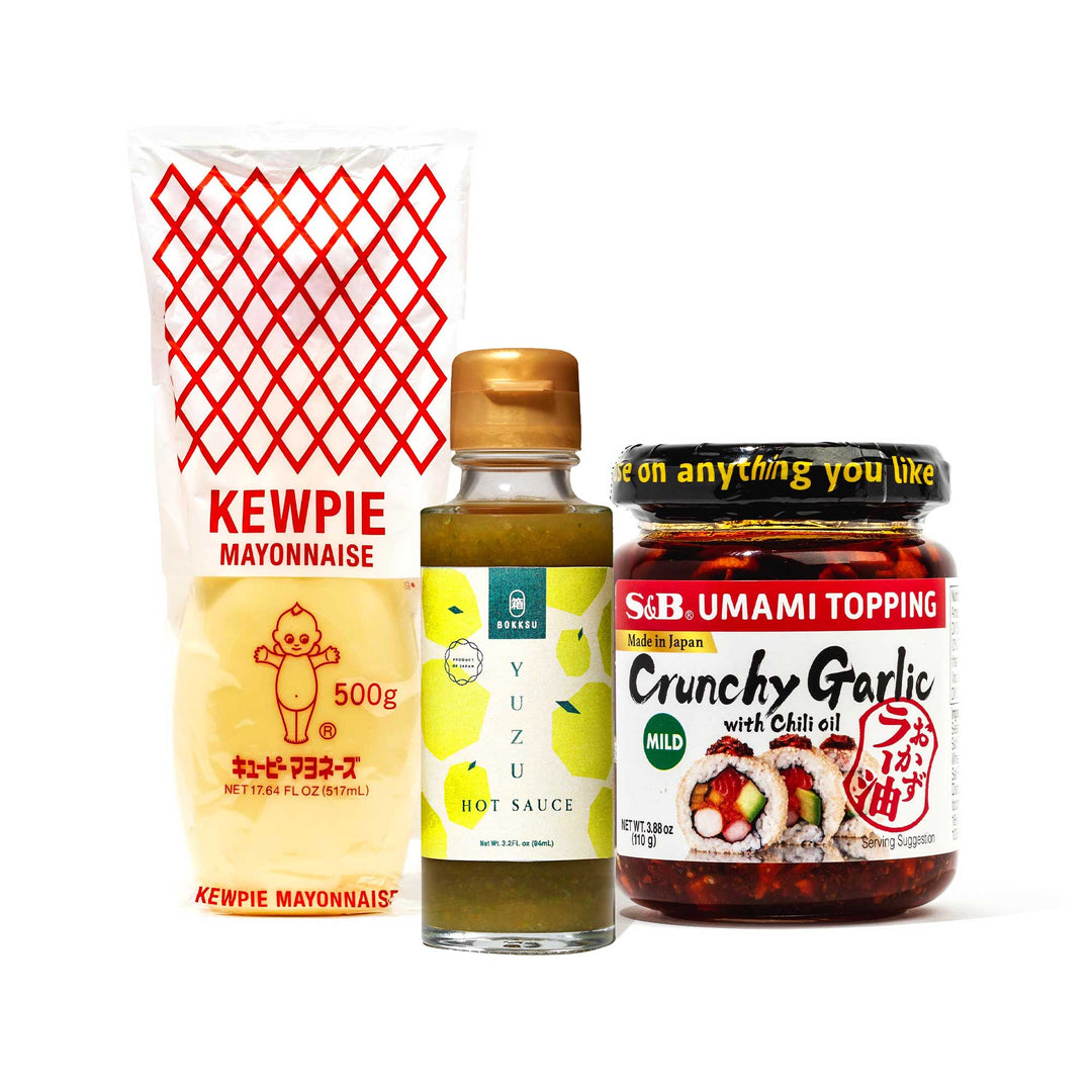 Three bottles of MULTI Japanese Condiments Pack for your pantry: kewpie mayonnaise, yuzu hot sauce, and crunchy garlic chili oil.