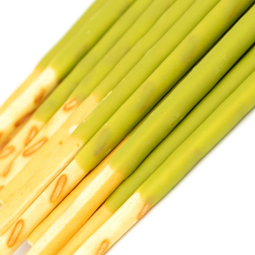 A close-up of Glico Pocky: Variety Pack biscuit sticks with green tea flavored coating.