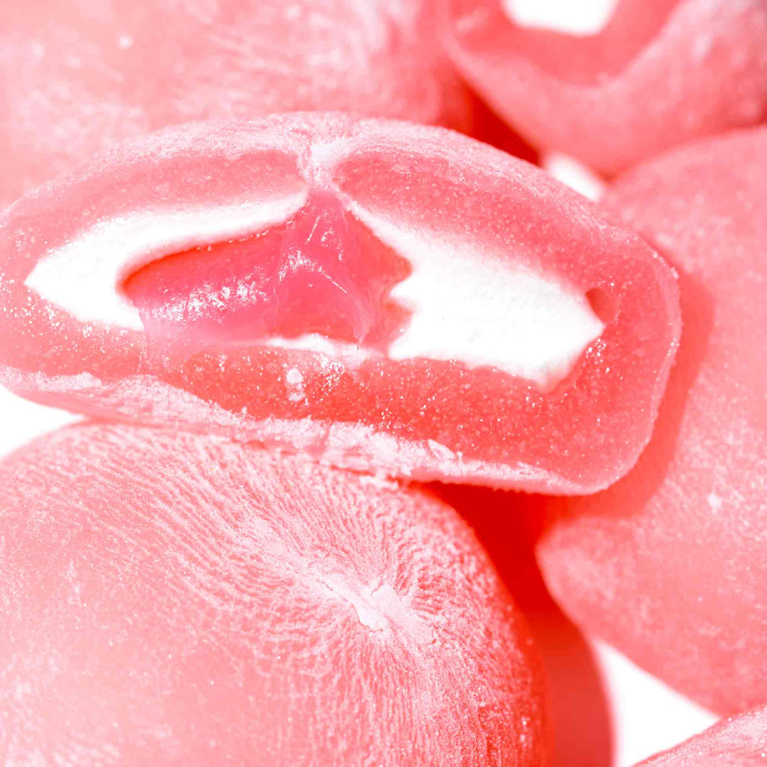 Close-up of pink, strawberry-flavored Kubota Daifuku Mochi candies.