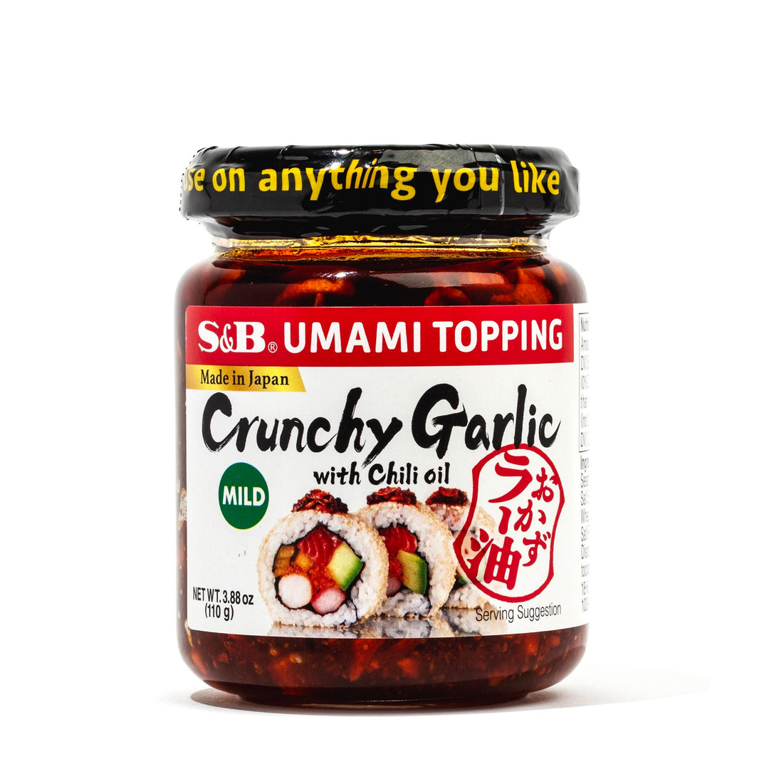 Jar of MULTI s&b umami topping, crunchy garlic with chili oil, a staple in Japanese cuisine condiments, mild flavor, made in Japan.