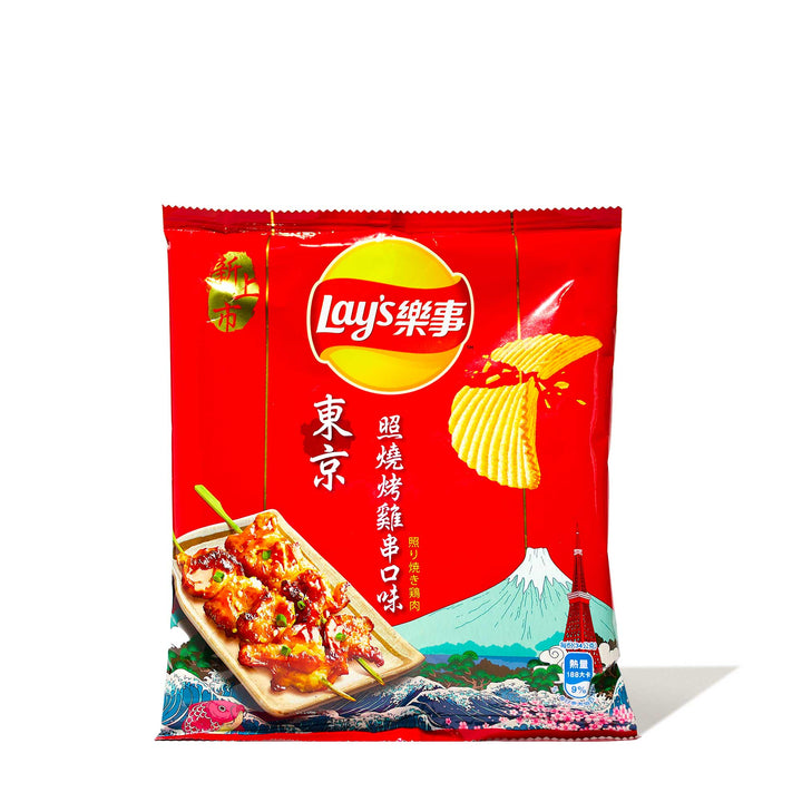 A Variety Pack of Asian Lay's Potato Chips with Chinese characters and imagery including Mount Fuji and a traditional grilled food item, offering bold flavors.