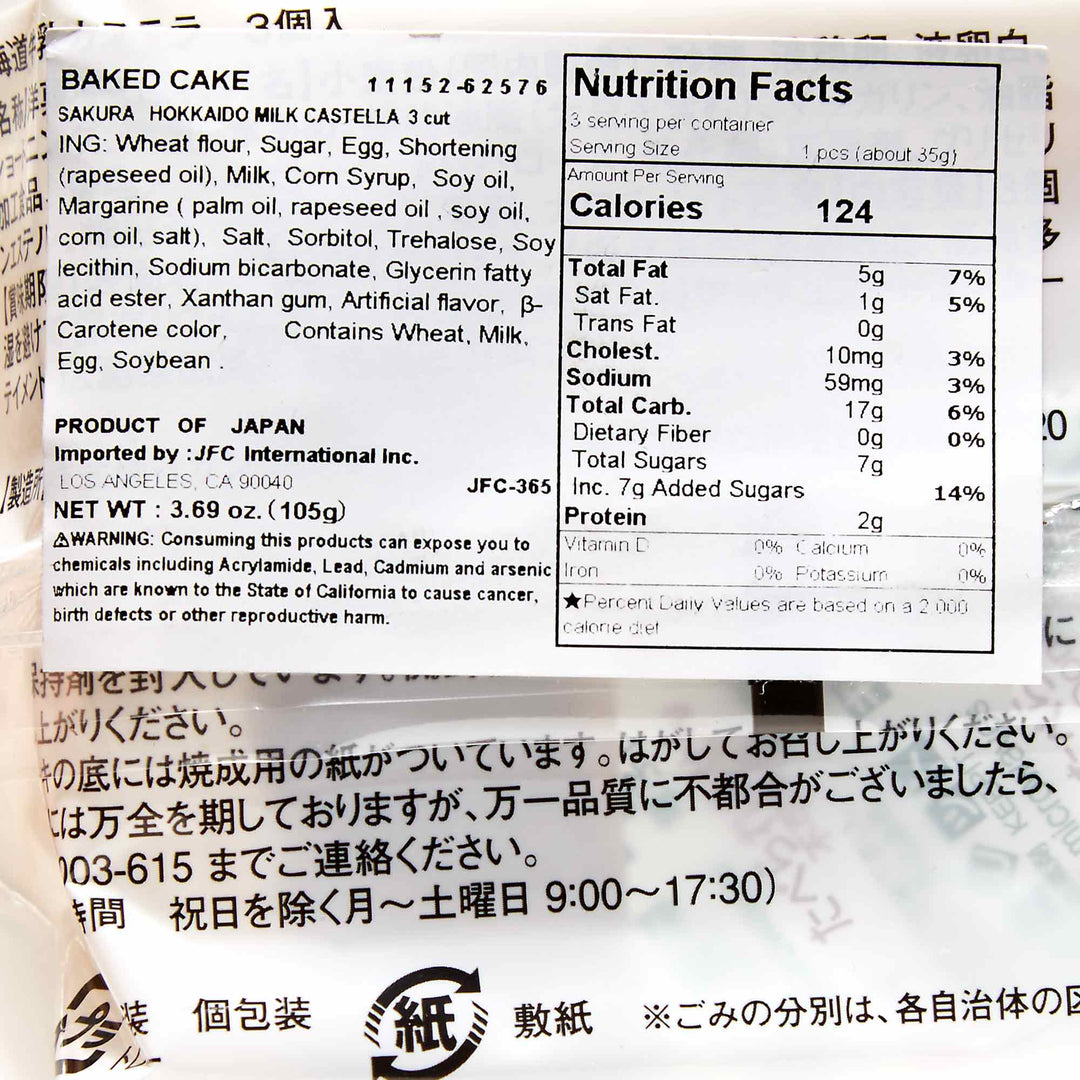 A close-up of a nutrition facts label and ingredients list on a Hokkaido Milk Sakura Castella Cake packaging.