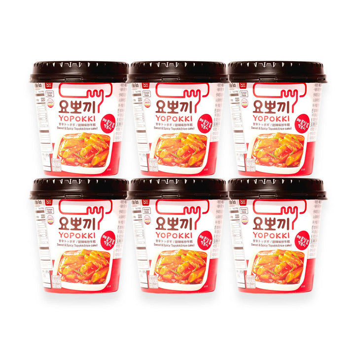 Six containers of Yopokki instant Tteokbokki rice cake cups arranged in two rows.