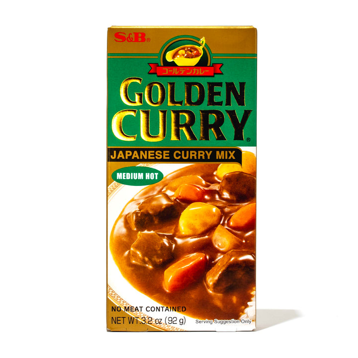 A box of S&B Golden Curry Sauce Mix: Medium Hot on a white background.