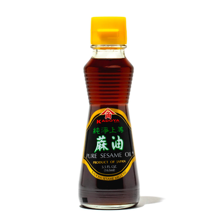 A bottle of Kadoya Pure Sesame Oil: 5.5 oz on a white background.