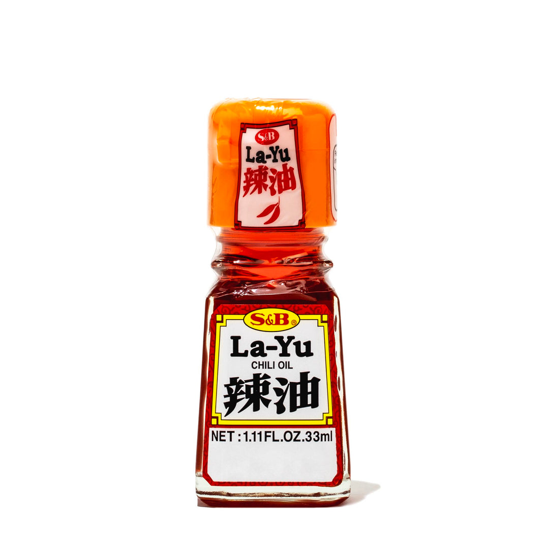 A bottle of S&B La-Yu Chili Oil on a white background.