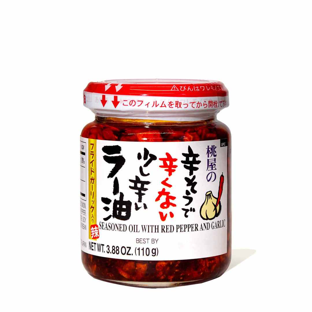A jar of Momoya Chili Oil with Fried Garlic on a white background.