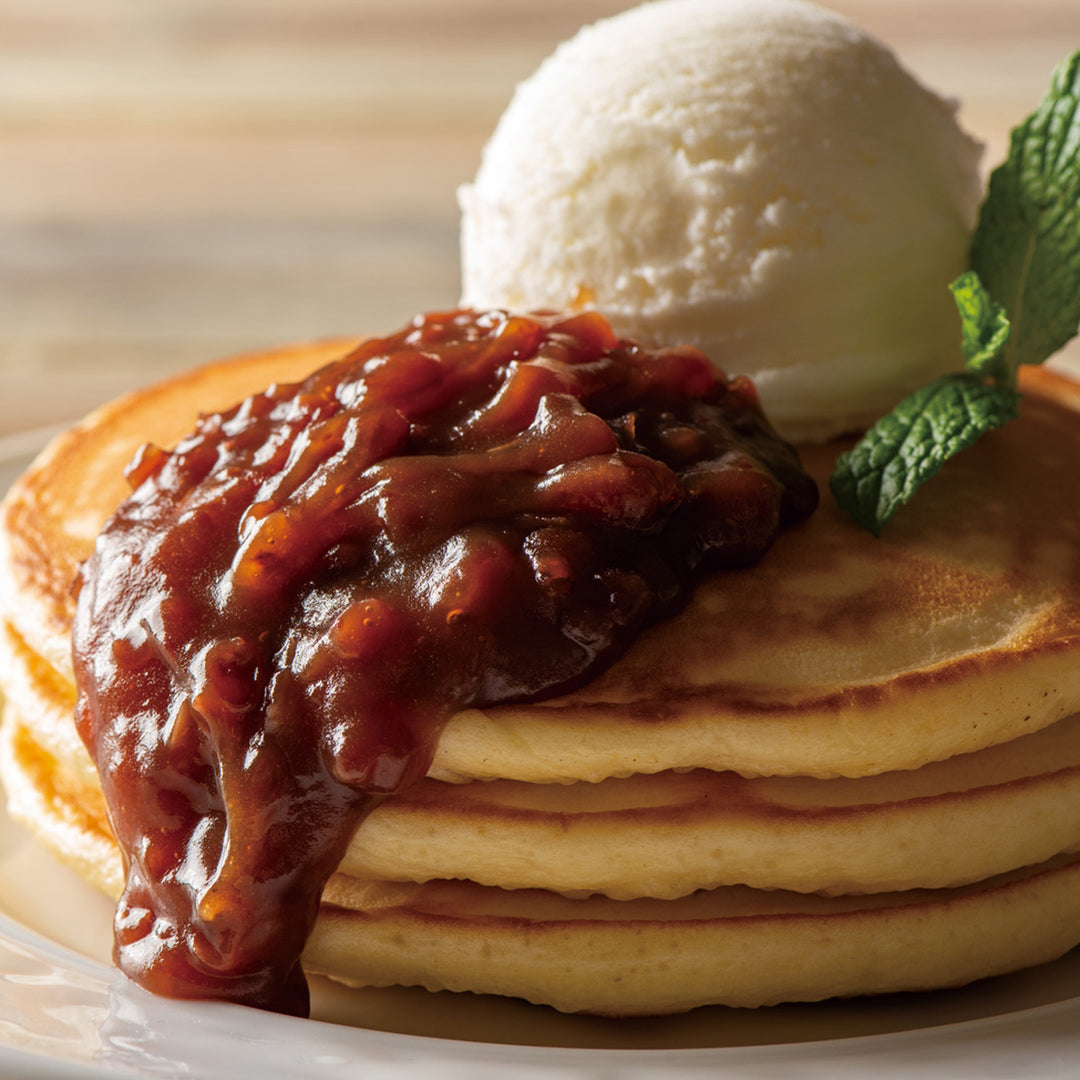 A stack of pancakes with Kuze Fuku Anko Red Bean Spread with Butter and ice cream.