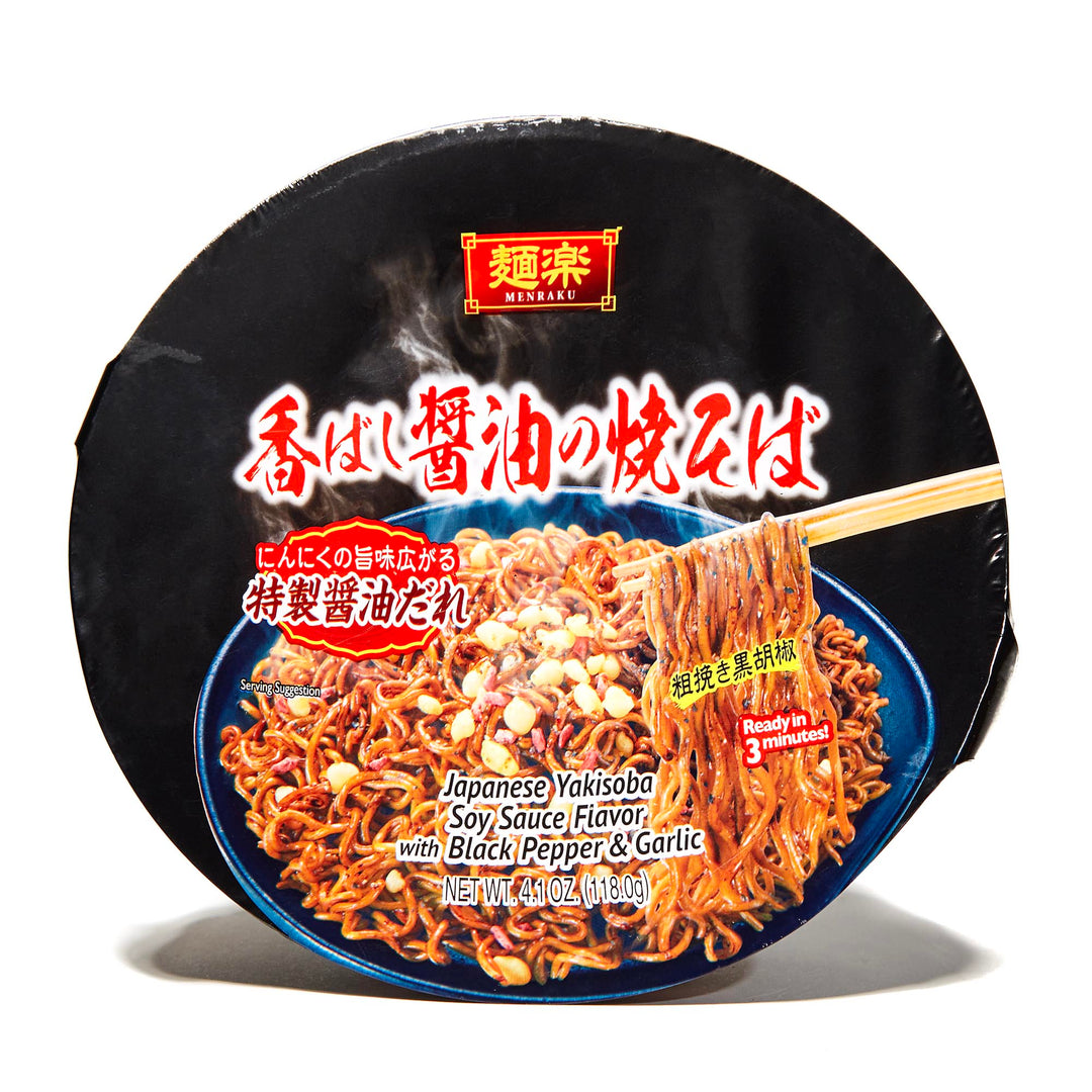 A packaged Hikari Menraku Yakisoba Bowl: Roasted Shoyu Black Pepper & Garlic 5 Pack noodle dish with soy sauce, black pepper, and garlic flavoring, and chopsticks lifting some noodles, against a black background.
