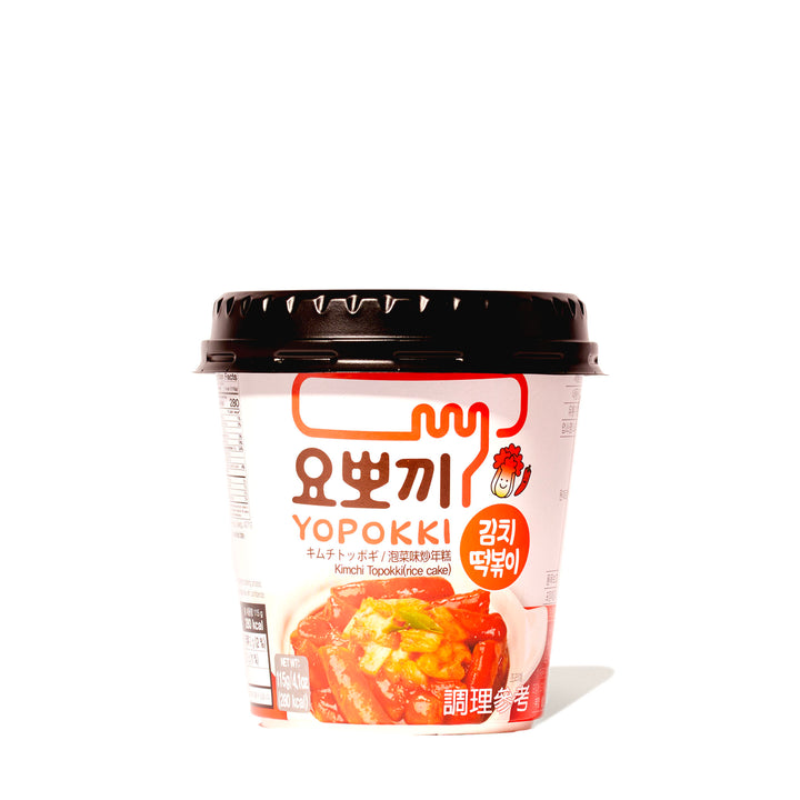 A cup of Yopokki Instant Tteokbokki Rice Cake Cup: Variety Pack, brimming with Korean flavors, against a white background.