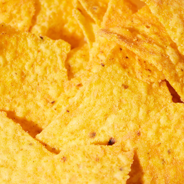 Close-up of a variety pack of crunchy Doritos tortilla chips with flavor explosion seasoning.
