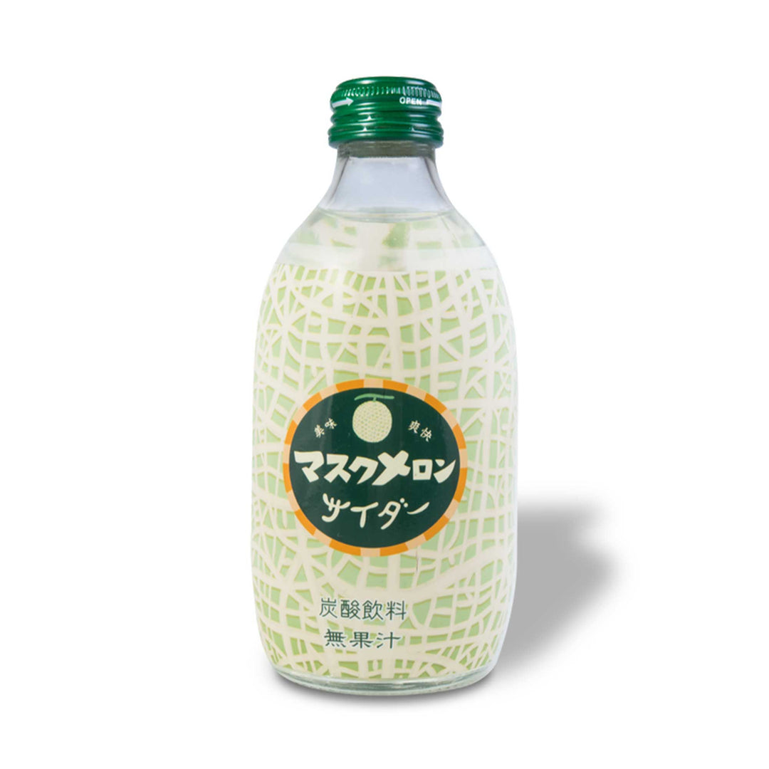 A bottle of Tomomasu Muskmelon Sparkling Soda with japanese writing on it.