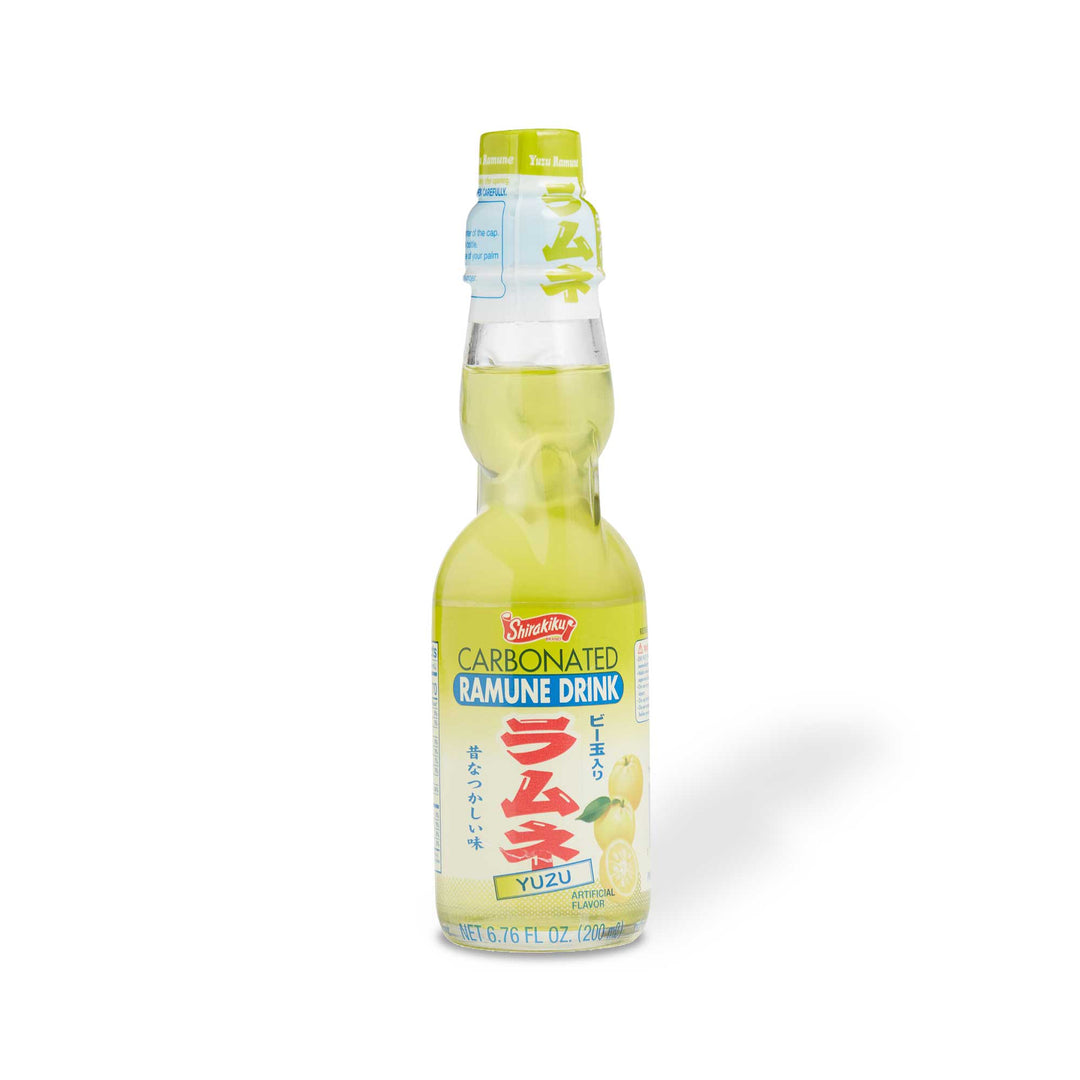 A bottle of Shirakiku Ramune Soda: Yuzu on a white background.