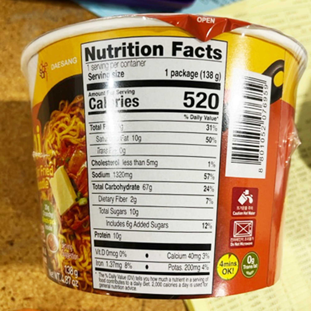 A cup of Jongga Kimchi Butter Stir Fried Noodle with nutrition facts.