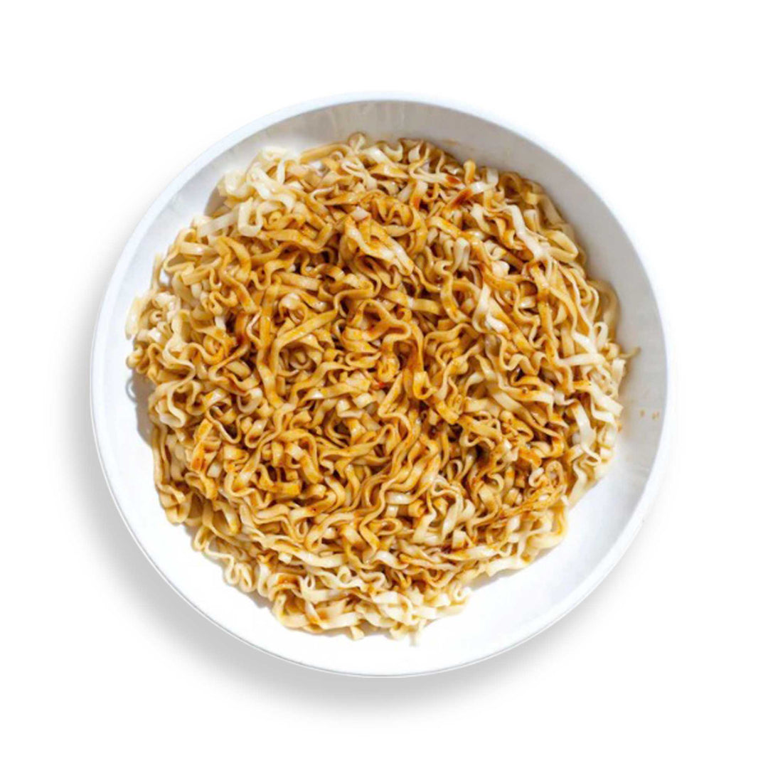 A bowl of Momofuku x A-Sha Premium Instant Noodles: Spicy Soy (5-pack) with umami-rich soy sauce and air-dried noodles on a white background.