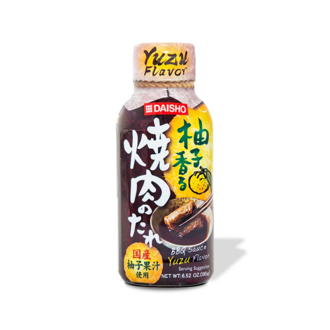 A bottle of Daisho Yuzu BBQ Dipping Sauce on a white background.