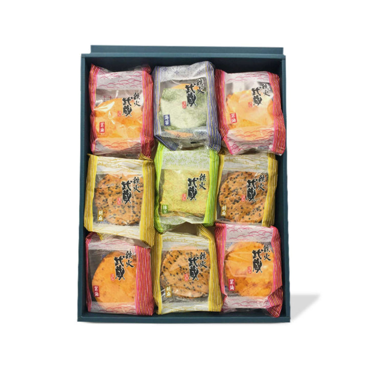 An Honda Tekka Musashi Assorted Crunchy Rice Crackers (27 pieces) box of snacks for Japanese snack lovers, featuring crunchy rice crackers and more.