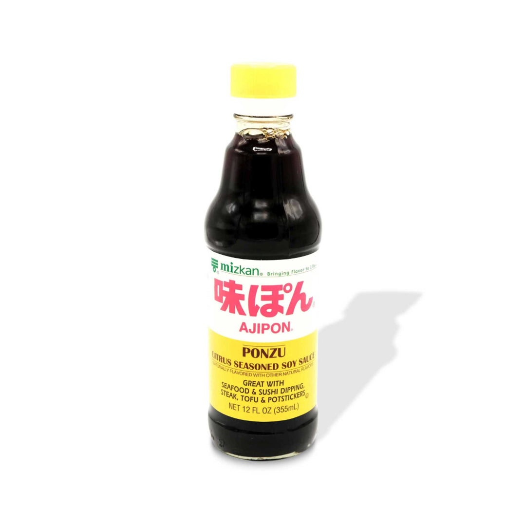A bottle of Mizkan Ajipon Citrus Ponzu Sauce, a Japanese pantry staple, on a white background.