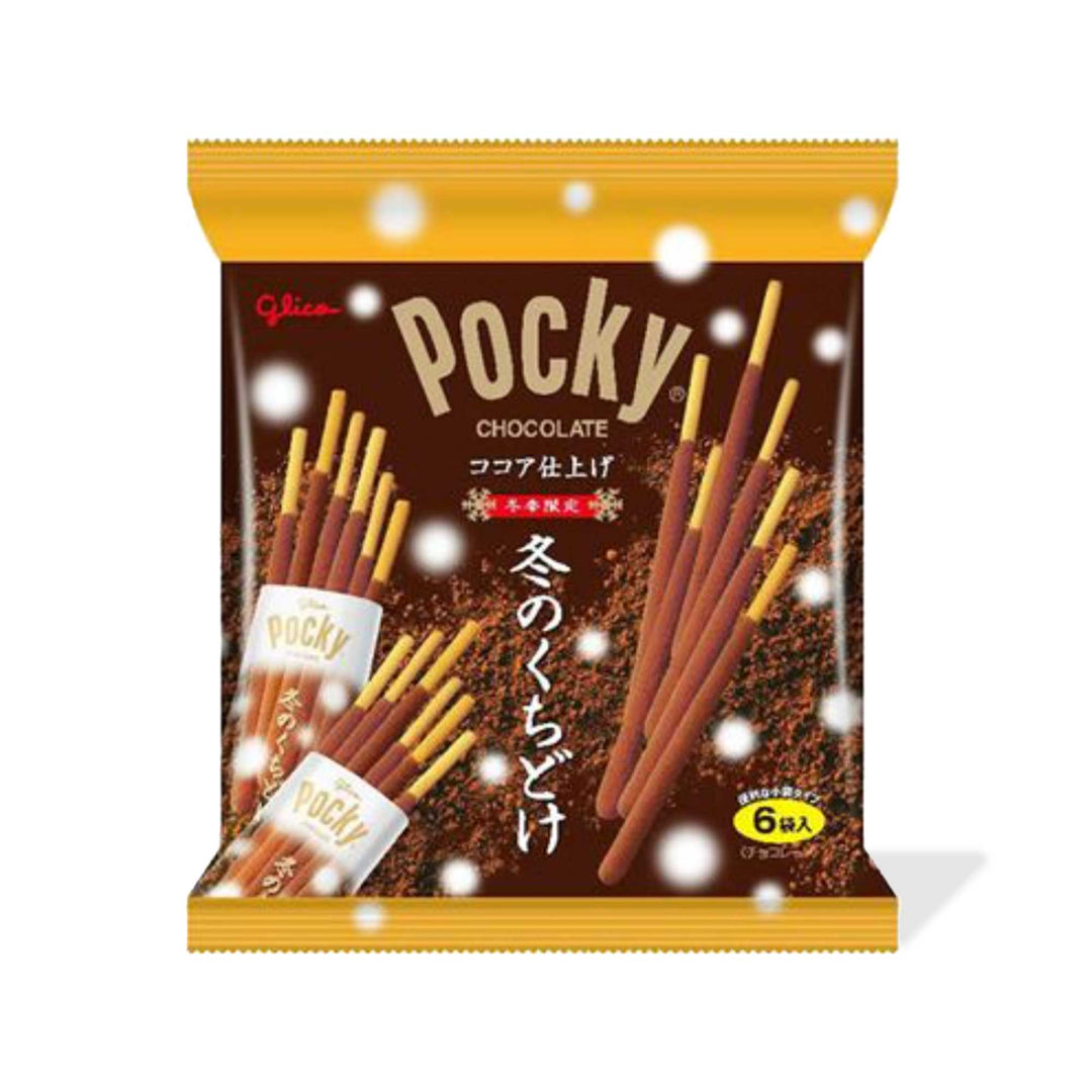 A package of Glico Pocky Winter Melty (6-pack) chocolate-covered biscuit sticks with Japanese text, displayed on a brown background.