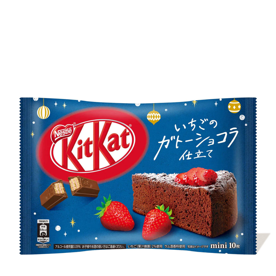 Package of Nestle Japan Japanese Kit Kat: Strawberry Chocolate Cake, featuring an image of chocolate pieces, strawberries, and a strawberry chocolate cake. Japanese text suggests a special or limited edition.