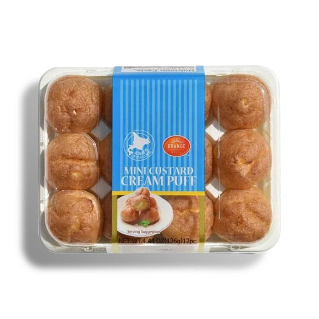 An Orange plastic container with a bunch of Patisserie Petit Cream Puff: Original Hokkaido Custard doughnuts in it.