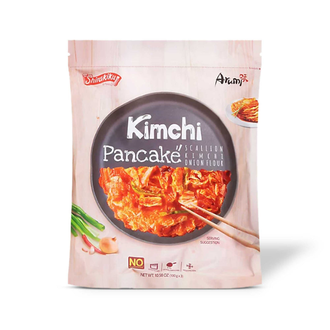 Shirakiku Pajeon Korean Pancake: Kimchi pancakes with chopsticks on a white background, highlighting the Korean influence.