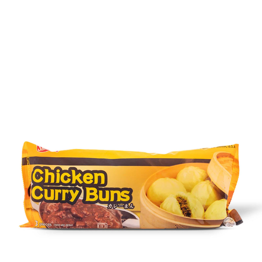 A bag of Shirakiku Chicken Curry Buns bursts on a white background.