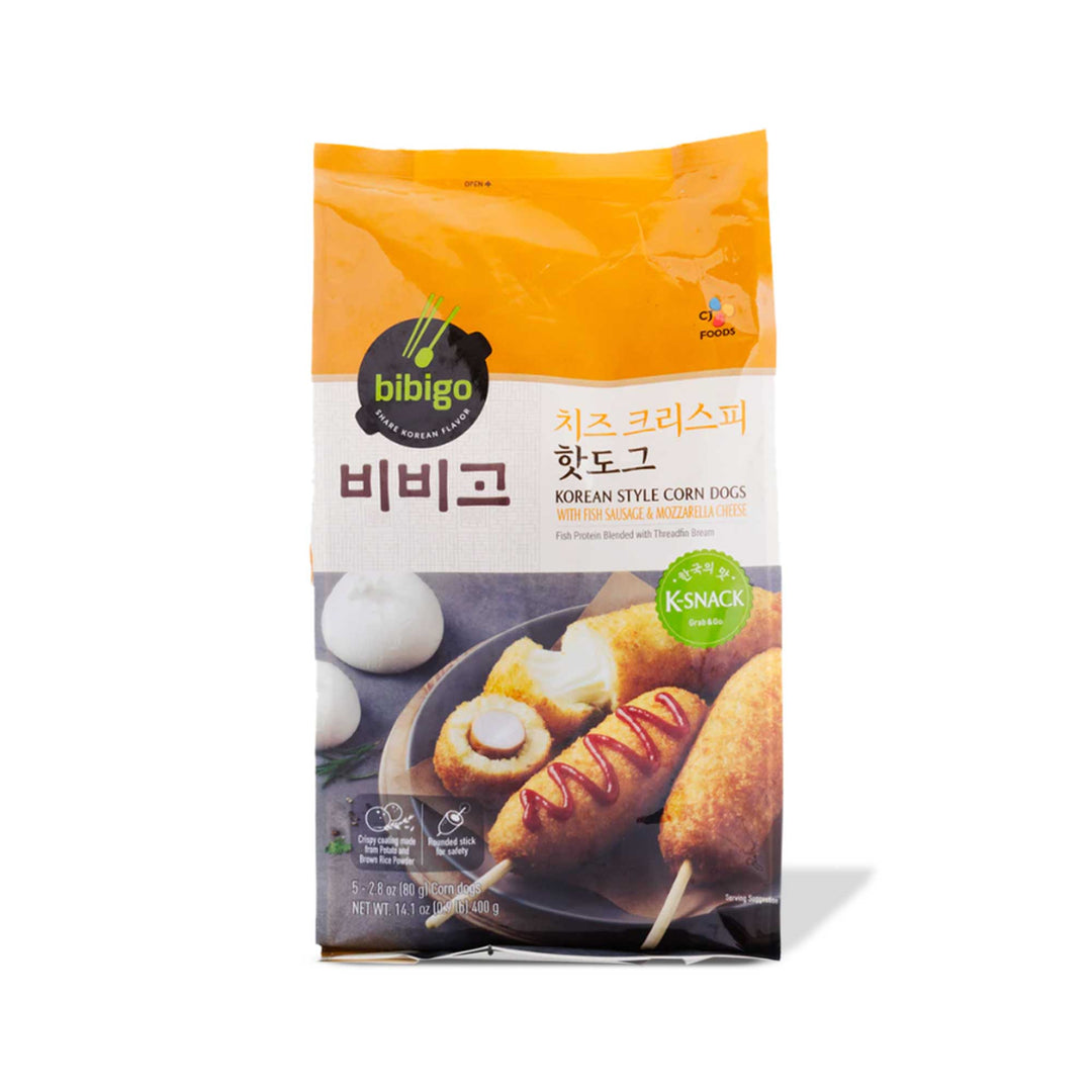 A bag of crunchy, cheesy Bibigo Korean Corn Dogs: Mozzarella & Fish Sausage on a white background.