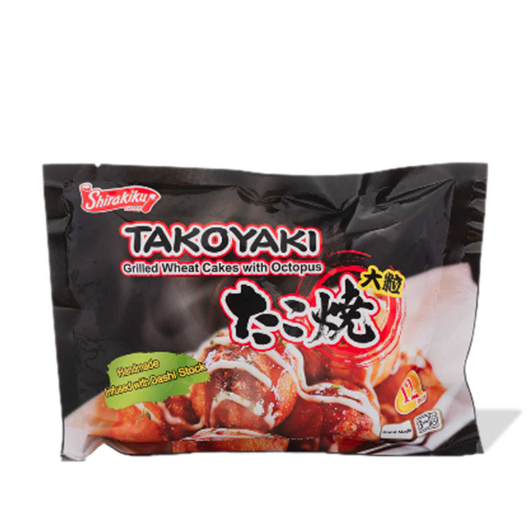 A bag of Shirakiku Takoyaki Japanese Octopus Balls on a white background, sprinkled with Ajishima Furikake Rice Seasoning.