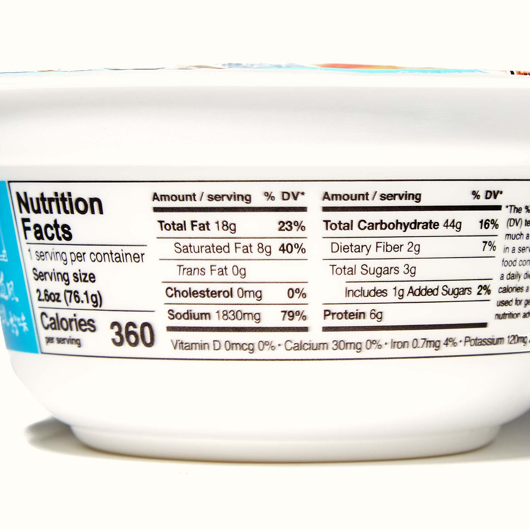 A close-up view of a nutrition facts label on a Hikari Menraku: Variety Pack showing serving size, calories, and various nutrient amounts.