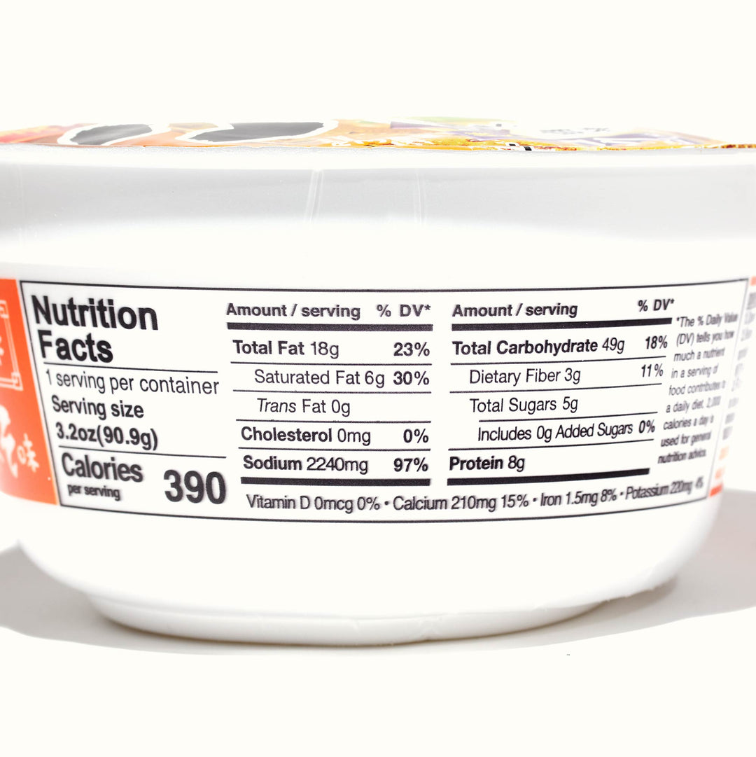 Nutritional label on a food container showing calorie content and breakdown of fat, carbohydrates, protein, and umami per serving of Hikari Menraku: Variety Pack ramen.