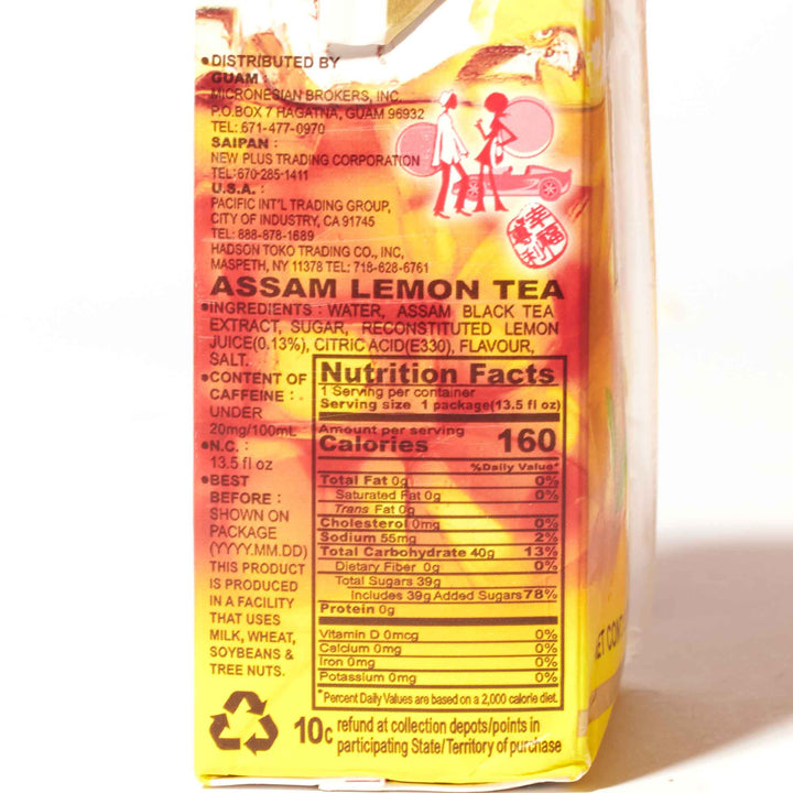 A box of T. Grand Assam Lemon Black Tea (6-pack) on a white surface.