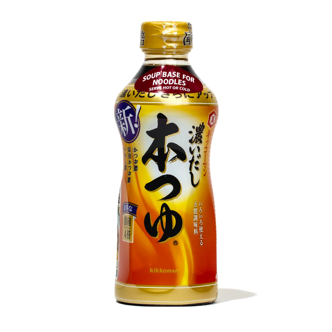 A bottle of Kikkoman Hon Tsuyu Soup Base on a white background.