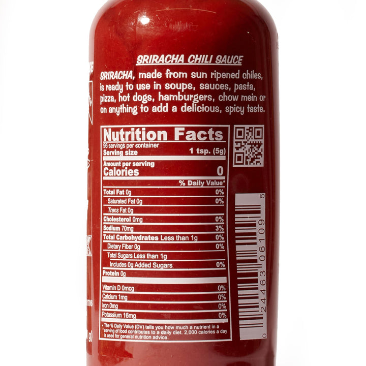 A Huy Fong Sriracha Hot Chili Sauce bottle on a white background.