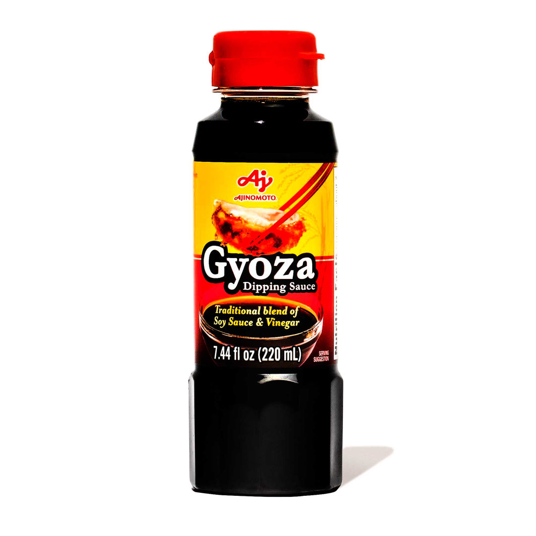A bottle of Ajinomoto Gyoza Dipping Sauce on a white background.