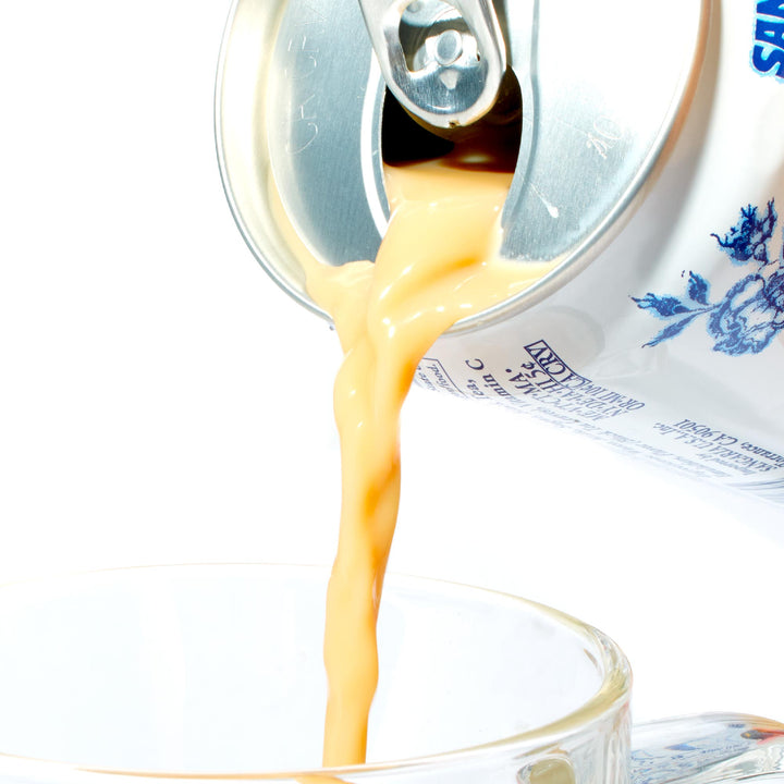 A can of Sangaria Royal Milk Tea being poured into a cup.