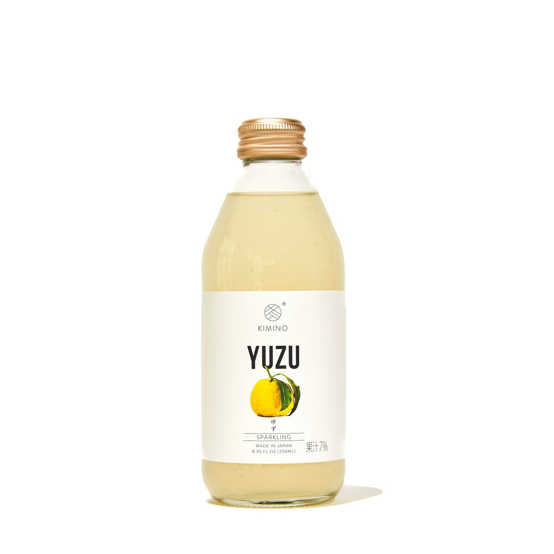 A bottle of Kimino Sparkling Juice: Yuzu on a white background.