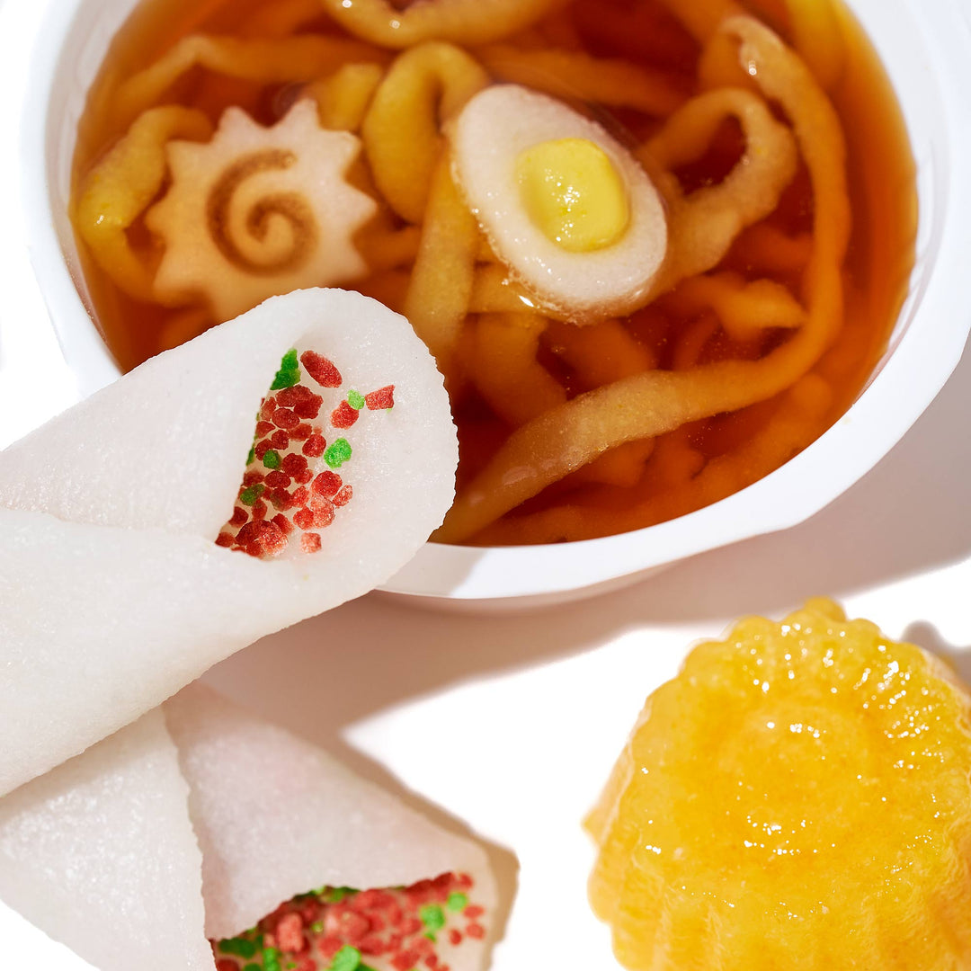 A Kracie Popin Cookin DIY Candy: Ramen with a cup of soup and a bowl of dumplings.