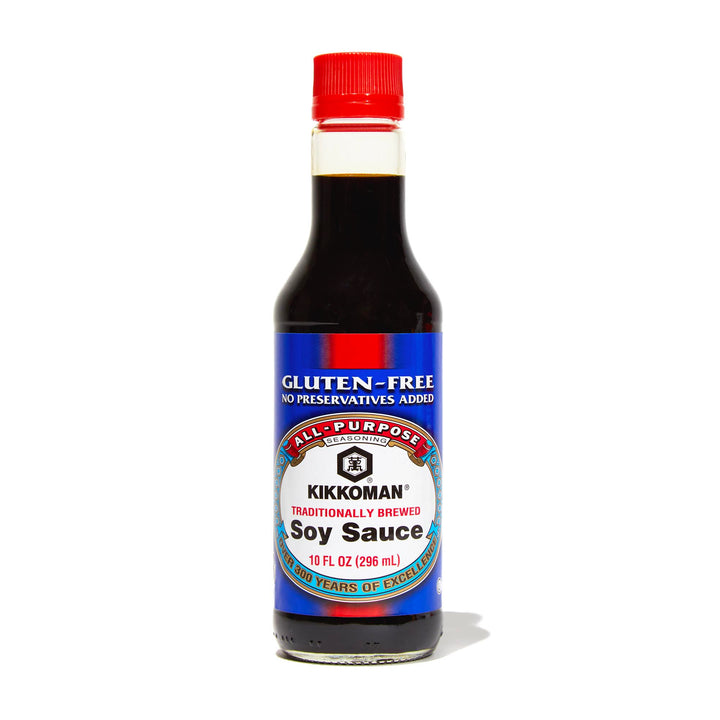 A bottle of Kikkoman Gluten-Free Soy Sauce on a white background.