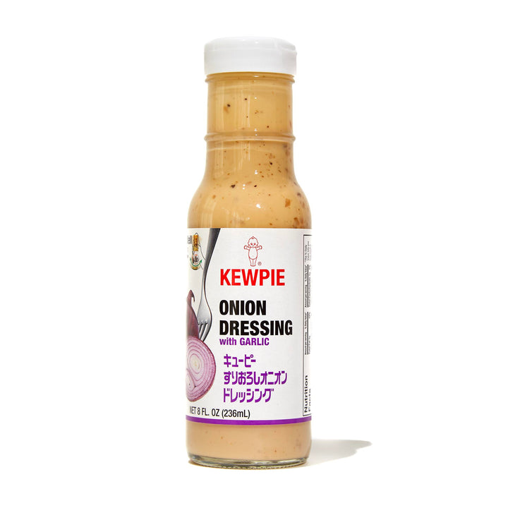 A bottle of Kewpie Onion Dressing with Garlic on a white background.