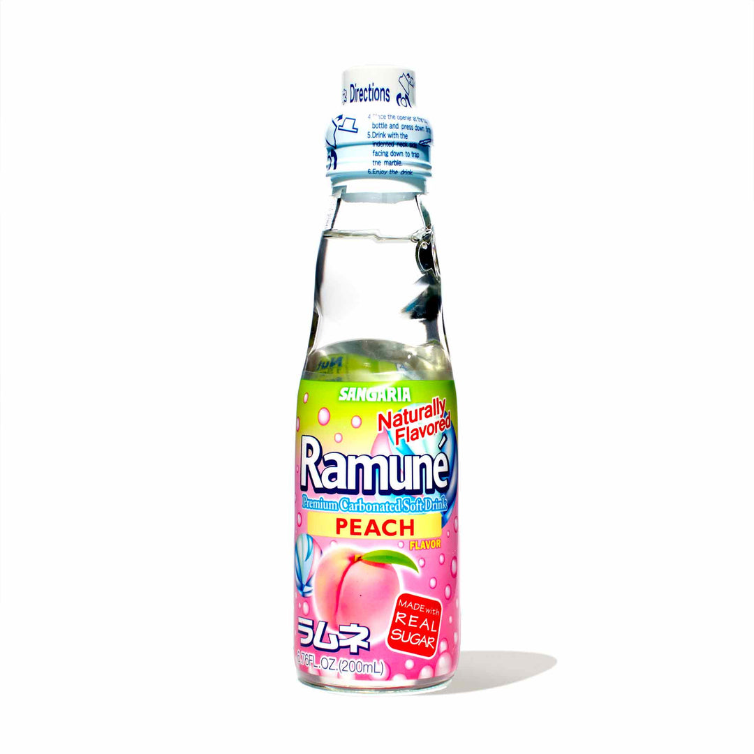 A bottle of Sangaria Ramune Soda: Peach on a white background.