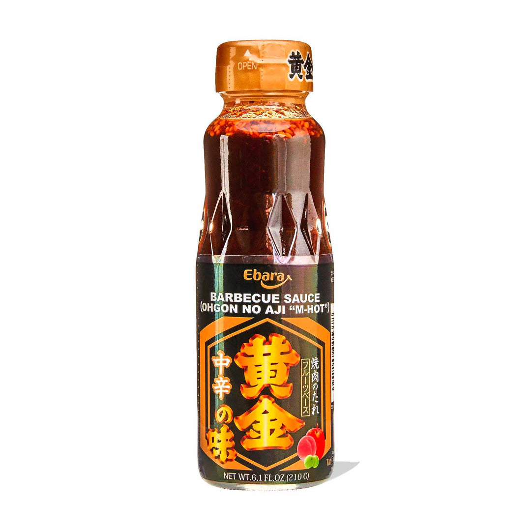 A bottle of Ebara Ohgon no Aji Sauce: Medium Hot on a white background.