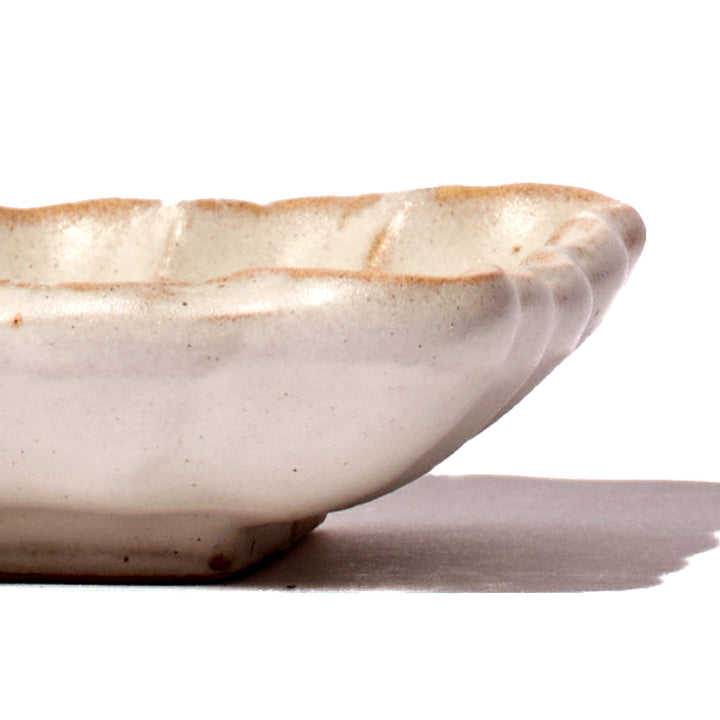 A small Kikka Kobiki Ivory Square Dish from MTC on a white surface.