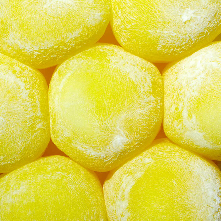 A close up of a bunch of Kubota Daifuku Mochi: Lemon ice cubes.