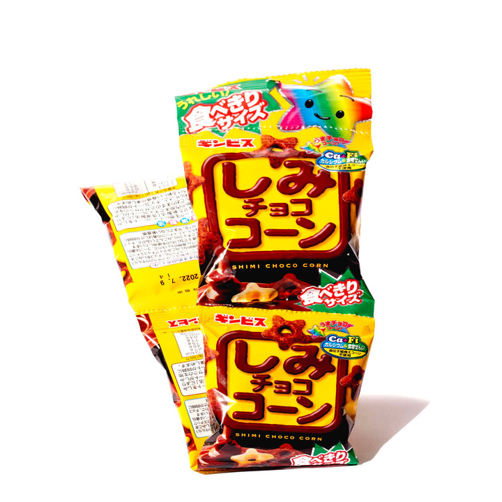Two packages of Ginbis Shimi Choco Puff Snack (4-pack) on a white background.