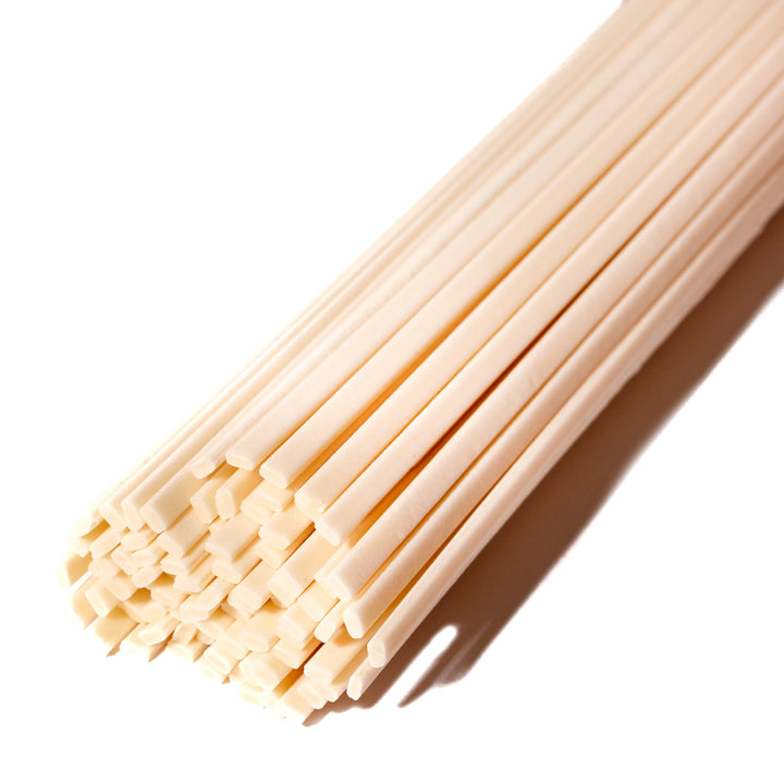 A bunch of Akagi wooden sticks on a white background.