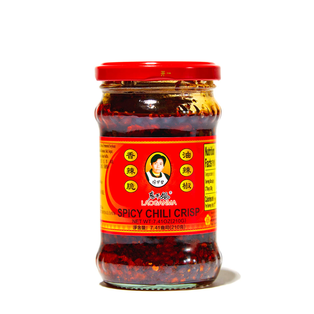 A jar of Lao Gan Ma Spicy Chili Crisp on a white background.