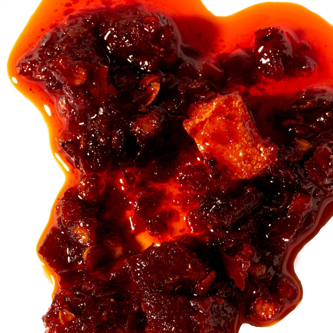 Lao Gan Ma Chili Oil with Fermented Soybeans on a white background.
