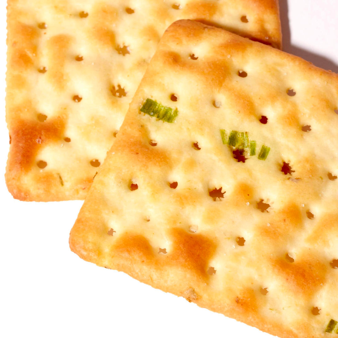 Two Chung Hsiang Soda Crackers: Green Onion on a white surface.