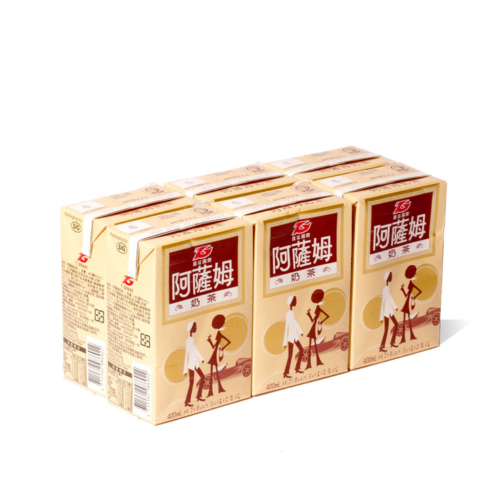 Four boxes of T. Grand Assam Milk Tea (6-pack) on a white background.